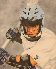 A boy playing lacrosse