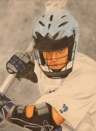 A boy playing lacrosse